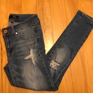 Medium wash distressed skinny jeans